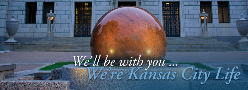 a large marble ball water fountain, also colloquially known as the Kansas City Life Kugel Stone