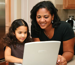 Mother and child looking at computer